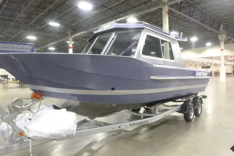 Slide: The Image of 2026 KingFisher 2425 Escape HT boat on trailer in indoor showroom. - 12