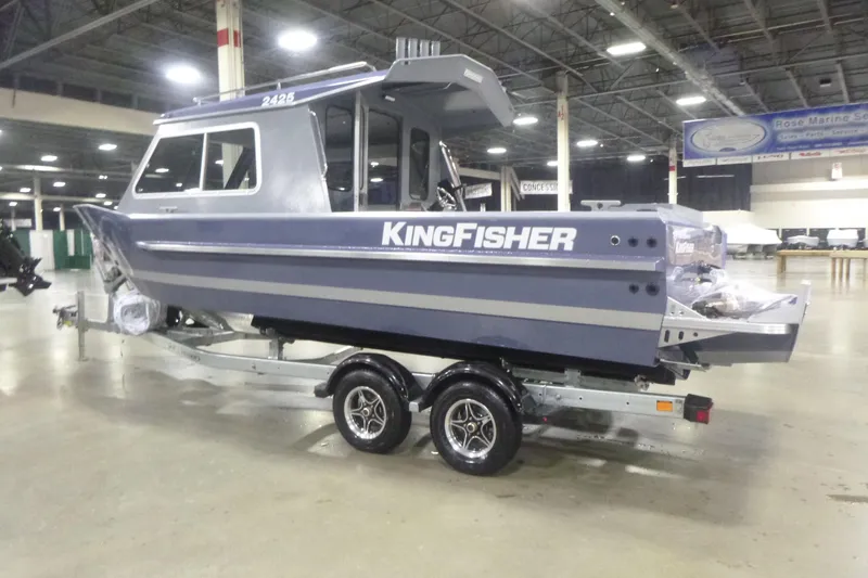 Slide: The Image of 2026 KingFisher 2425 Escape HT boat on trailer in indoor showroom. - 13