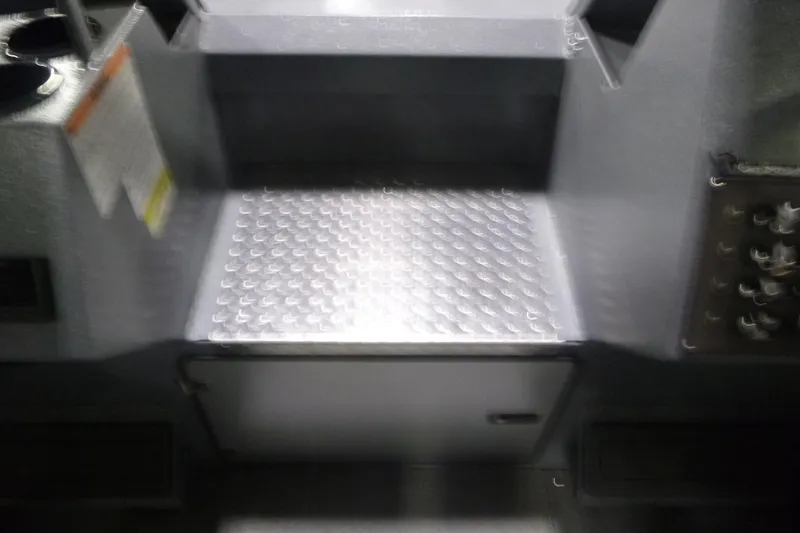 Slide: The Image of Interior of 2026 KingFisher 2425 Escape HT boat, featuring a metallic step. - 17