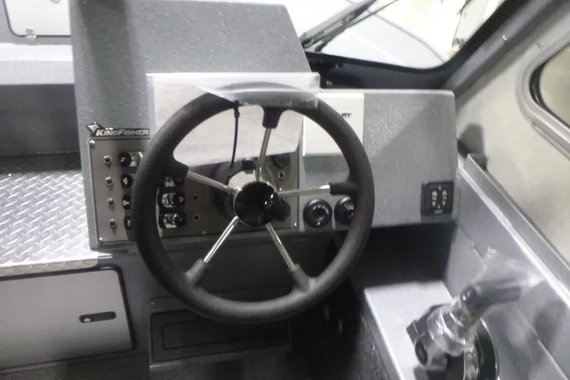 Slide: The Image of Steering wheel and controls of 2026 KingFisher 2425 Escape HT boat. - 19
