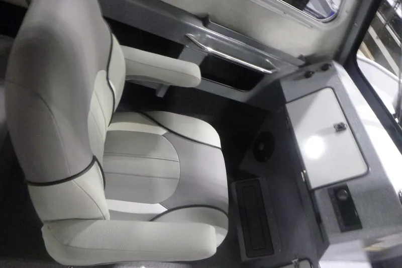 Slide: The Image of Interior of 2026 KingFisher 2425 Escape HT boat, featuring a comfortable captain's chair. - 20