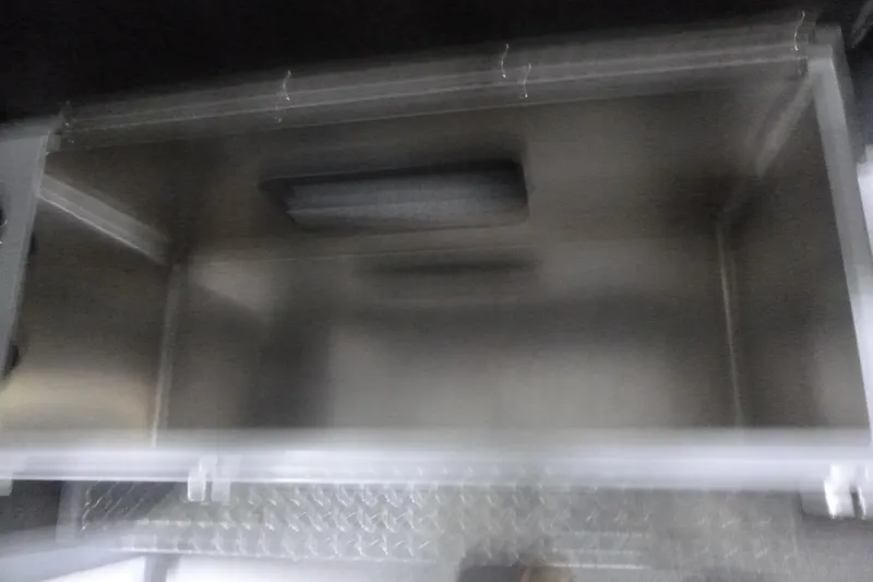 Slide: The Image of Blurred interior view of a 2026 KingFisher 2425 Escape HT boat compartment. - 23
