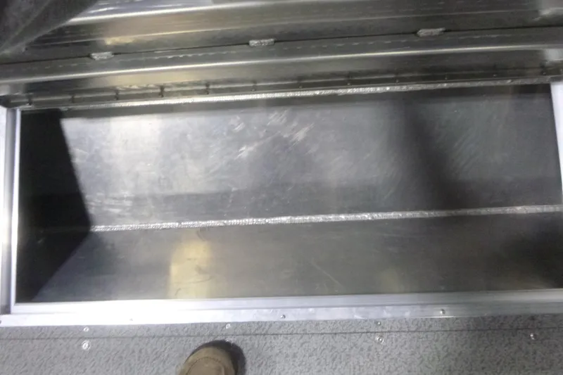 Slide: The Image of Open storage compartment in 2026 KingFisher 2425 Escape HT boat interior. - 26