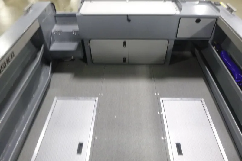 Slide: The Image of Interior of 2026 KingFisher 2425 Escape HT boat, featuring storage compartments and seating. - 28