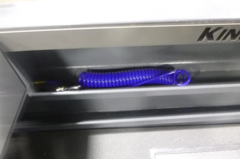 Slide: The Image of Coiled blue hose in KingFisher 2425 Escape HT boat compartment, 2026 model. - 32