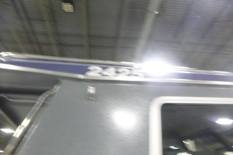 Slide: The Image of Blurry image of KingFisher 2425 Escape HT boat under bright lights. - 33
