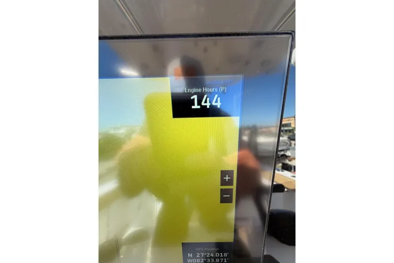 Slide: The Image of Display screen showing 144 engine hours on 2023 Sportsman Heritage 241 Center Console. - 14