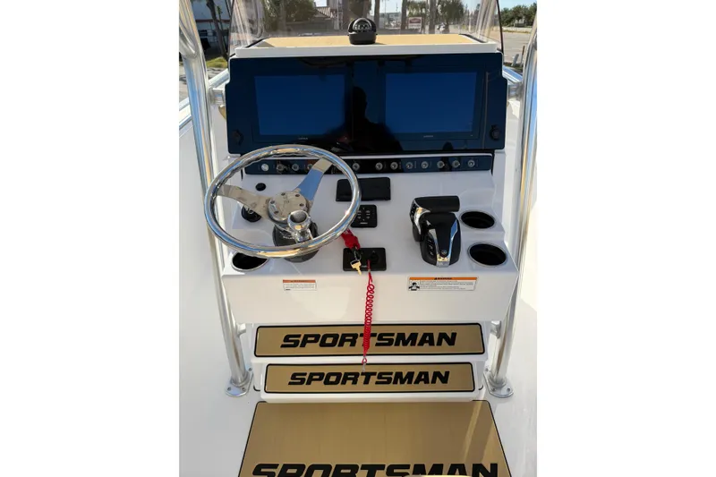 Slide: The Image of 2023 Sportsman Heritage 241 Center Console dashboard with steering wheel and controls. - 4