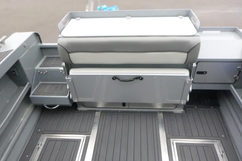 Slide: The Image of 2026 KingFisher 25 XAC boat interior with seating and storage compartments. - 11