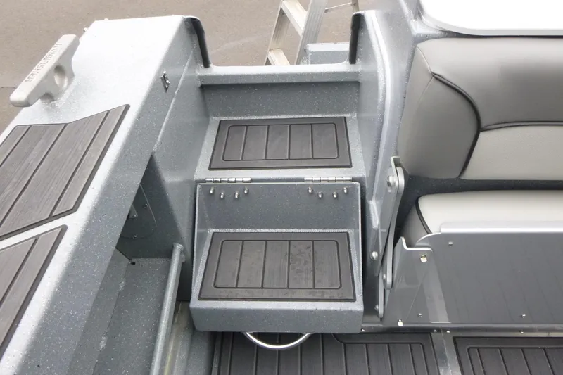 Slide: The Image of 2026 KingFisher 25 XAC boat interior with sleek seating and storage compartments. - 14