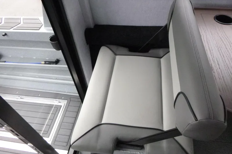 Slide: The Image of Interior seating of 2026 KingFisher 25 XAC boat, featuring sleek gray upholstery. - 23