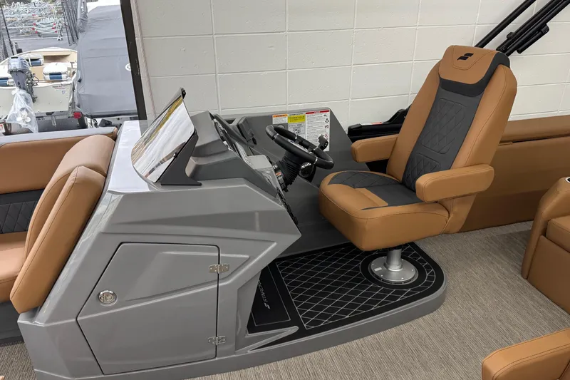 Slide: The Image of Captain's seat and helm of 2026 Starcraft SLS 3 Q DH boat, featuring modern design. - 11