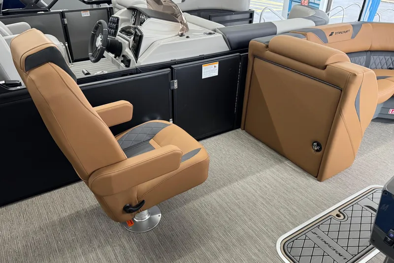 Slide: The Image of Luxurious interior of 2026 Starcraft SLS 3 Q DH boat with tan seating and modern dashboard. - 16