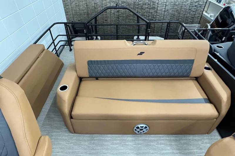 Slide: The Image of 2026 Starcraft SLS 3 Q DH boat interior with tan seating and cup holders. - 17