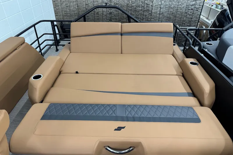 Slide: The Image of 2026 Starcraft SLS 3 Q DH boat interior with tan leather seating and cup holders. - 20