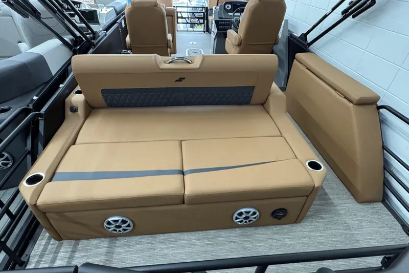 Slide: The Image of 2026 Starcraft SLS 3 Q DH boat interior with tan seating and cup holders. - 21