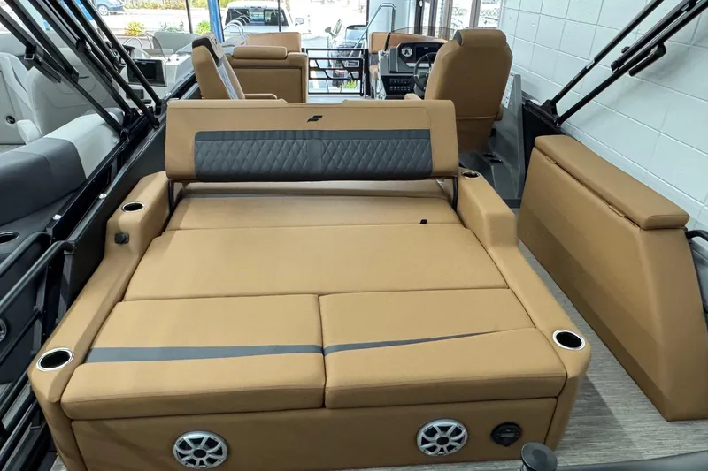 Slide: The Image of 2026 Starcraft SLS 3 Q DH boat interior with tan seating and cup holders. - 23