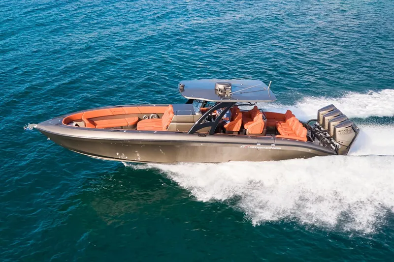 The Image of Midnight Express 37' Open boat cruising on blue ocean waters. - 0