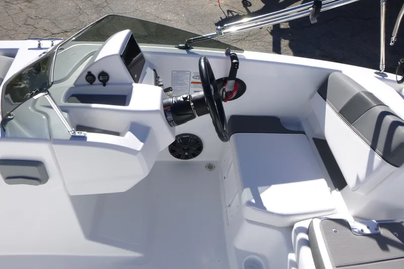 Slide: The Image of 2026 Tahoe T18 boat cockpit with steering wheel, dashboard, and seating area. - 10
