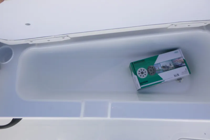 Slide: The Image of Storage compartment in 2026 Tahoe T18 boat with speaker box inside. - 14