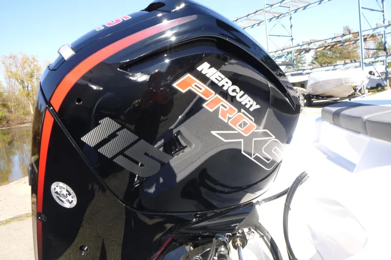Slide: The Image of Mercury Pro XS 115 engine on 2026 Tahoe T18 boat, dockside view. - 15