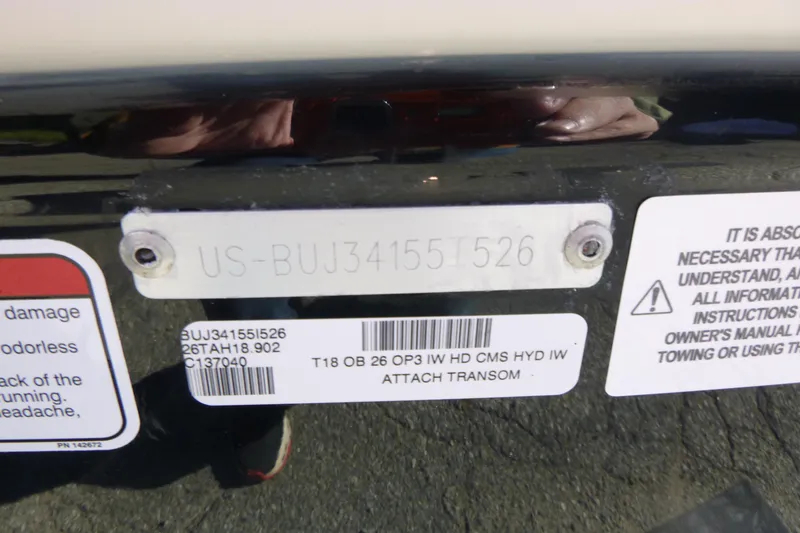 Slide: The Image of 2026 Tahoe T18 boat identification plate with serial number and warning labels. - 17