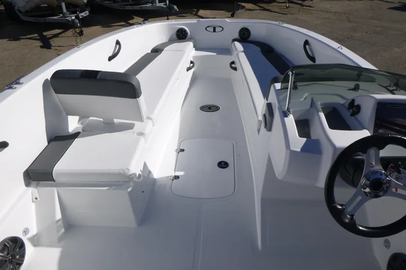 Slide: The Image of 2026 Tahoe T18 boat interior with sleek seating and modern steering console. - 4
