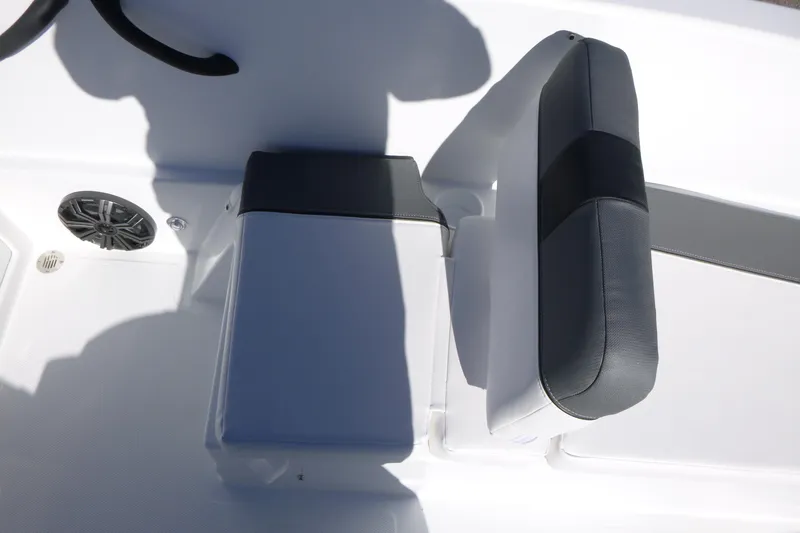 Slide: The Image of 2026 Tahoe T18 boat interior with cushioned seating and speaker. - 7