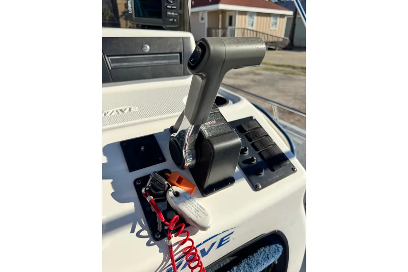 Slide: The Image of Throttle control on a 2001 Blue Wave 220 Classic boat dashboard. - 14