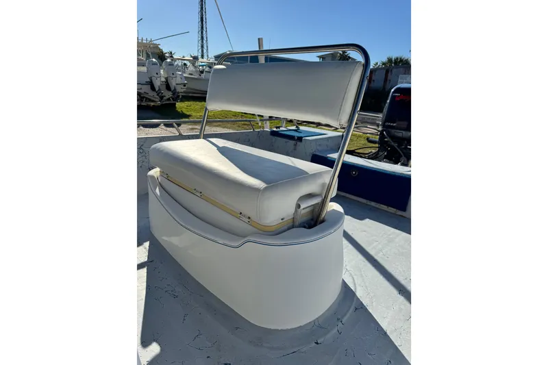 Slide: The Image of 2001 Blue Wave 220 Classic boat seat with stainless steel frame in sunlight. - 16