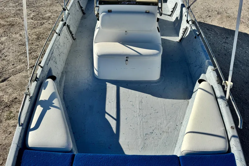Slide: The Image of 2001 Blue Wave 220 Classic boat interior with seating and console, viewed from above. - 18