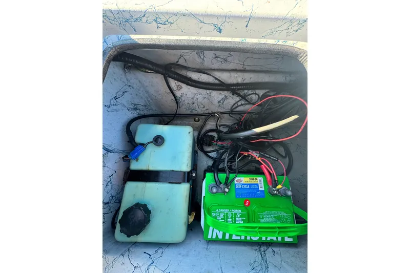 Slide: The Image of Battery and wiring inside a 2001 Blue Wave 220 Classic boat compartment. - 20