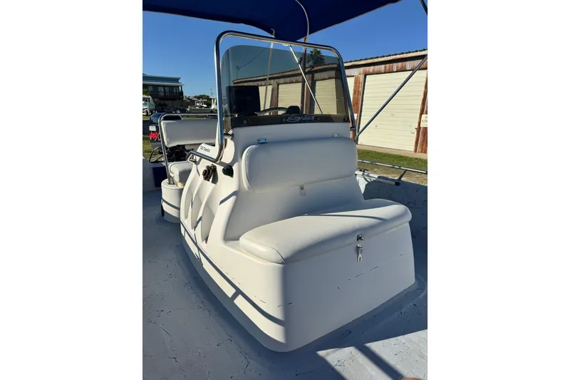 Slide: The Image of 2001 Blue Wave 220 Classic boat interior with white seating and console. - 5
