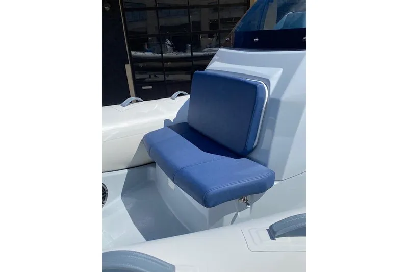 Slide: The Image of 2026 Brig Eagle 6 boat with blue cushioned seating, modern design. - 10