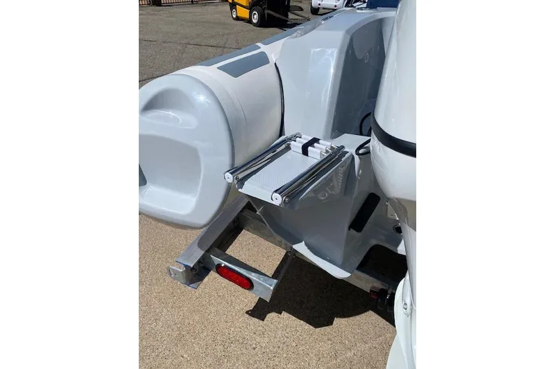 Slide: The Image of 2026 Brig Eagle 6 boat rear view with ladder and trailer attachment. - 11