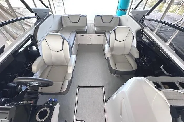 Slide: The Image of 2022 Yamaha Boats AR250 interior with modern seating and sleek design. - 11