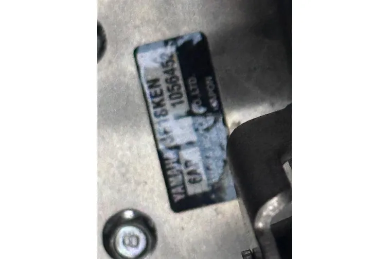 Slide: The Image of Close-up of a Yamaha AR250 2022 engine part with a visible label. - 21