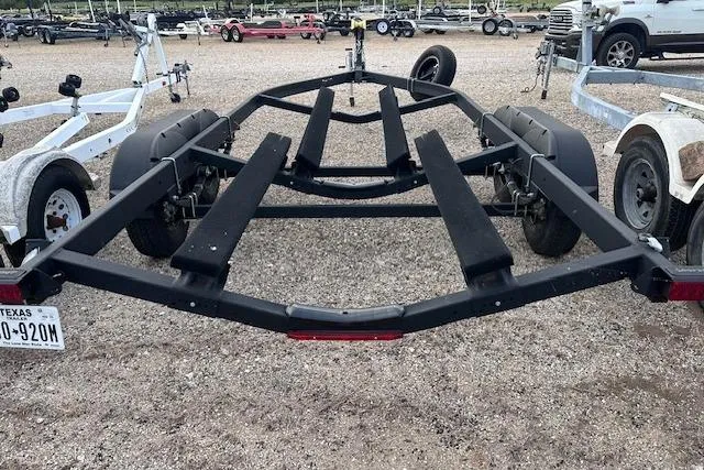 Slide: The Image of Trailer for 2022 Yamaha Boats AR250, parked on gravel lot with other trailers. - 39