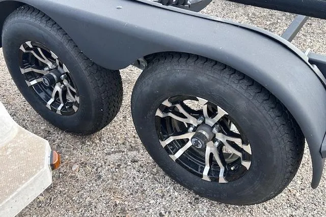 Slide: The Image of Trailer wheels for 2022 Yamaha Boats AR250, featuring stylish black and silver rims. - 42