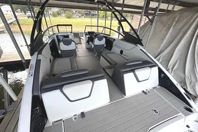 Slide: The Image of 2022 Yamaha Boats AR250 interior with sleek seating and modern design. - 7