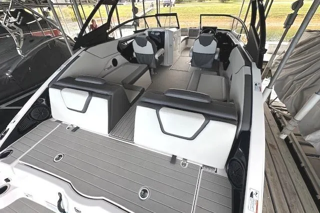 Slide: The Image of 2022 Yamaha Boats AR250 interior with sleek seating and modern design. - 8