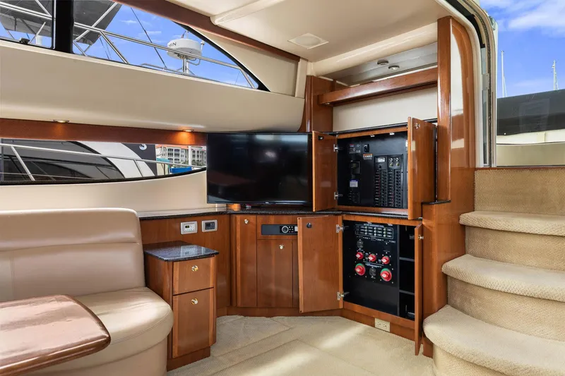Slide: The Image of Luxurious interior of 2008 Meridian 408 Motoryacht with entertainment system and elegant wood cabinetry. - 23