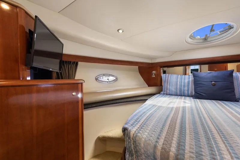 Slide: The Image of Luxurious 2008 Meridian 408 Motoryacht cabin with cozy bed and TV. - 35