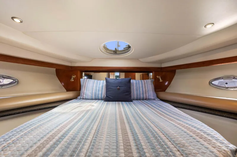 Slide: The Image of Luxurious cabin interior of 2008 Meridian 408 Motoryacht with cozy bedding and porthole windows. - 36