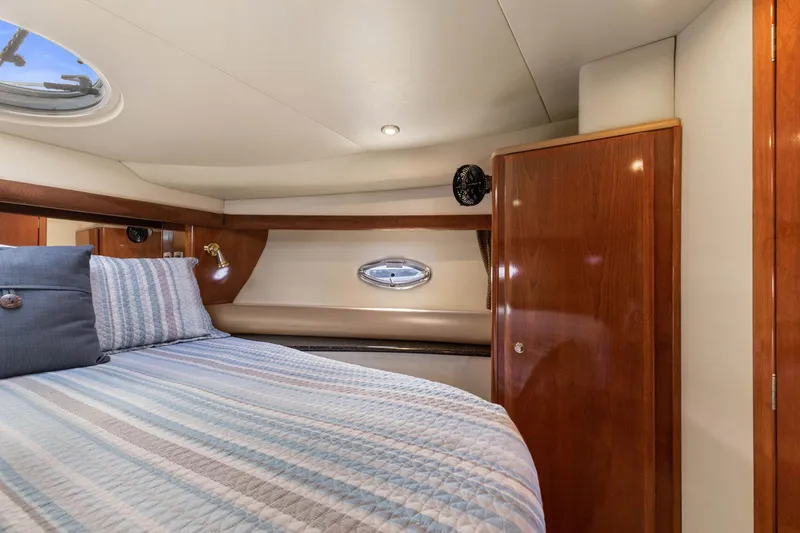 Slide: The Image of Luxurious cabin interior of 2008 Meridian 408 Motoryacht with cozy bed and wooden cabinetry. - 37