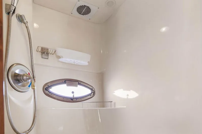Slide: The Image of Shower area in 2008 Meridian 408 Motoryacht with porthole and modern fixtures. - 50