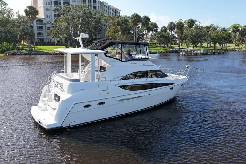 Slide: The Image of 2008 Meridian 408 Motoryacht cruising on a scenic river with lush greenery. - 60