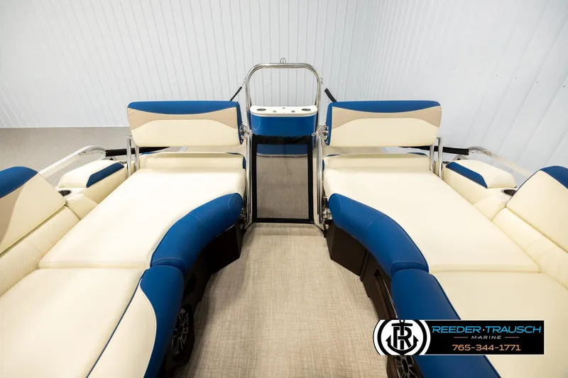 Slide: The Image of 2026 Avalon LSZ QLS boat interior with blue and beige seating, Reeder-Trausch Marine logo. - 15