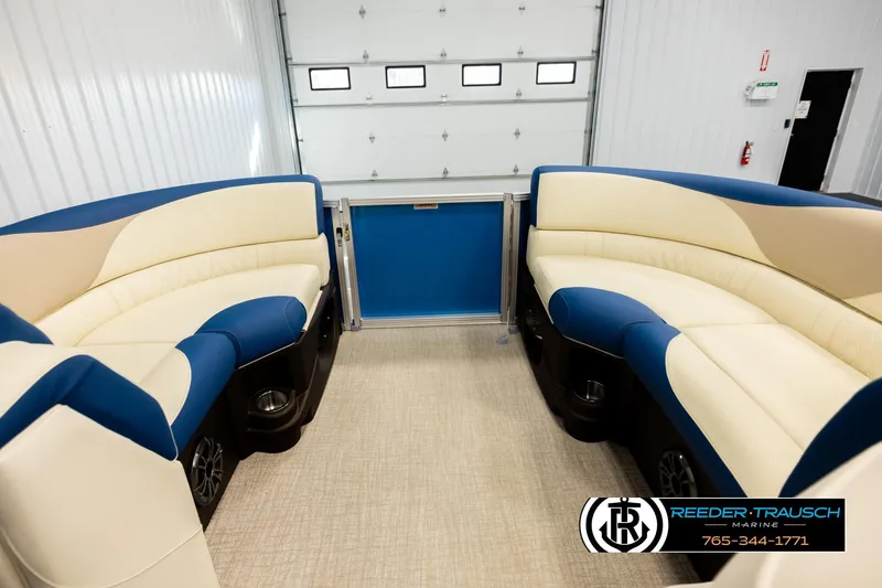 Slide: The Image of Luxurious interior of 2026 Avalon LSZ QLS pontoon boat with blue and beige seating. - 18