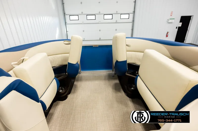 Slide: The Image of Luxurious interior of 2026 Avalon LSZ QLS pontoon boat with beige and blue seating. - 19